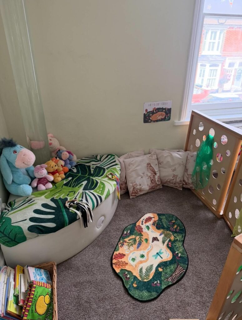 Cosy reading corner with cushions and soft toys