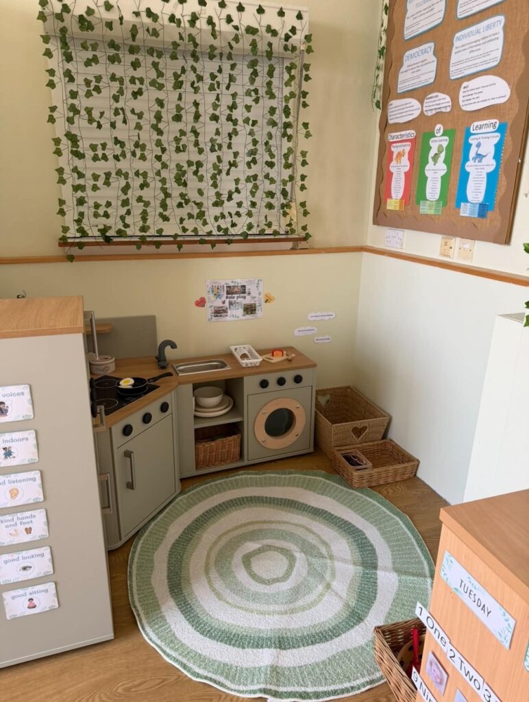 Role-play kitchen corner with a round rug